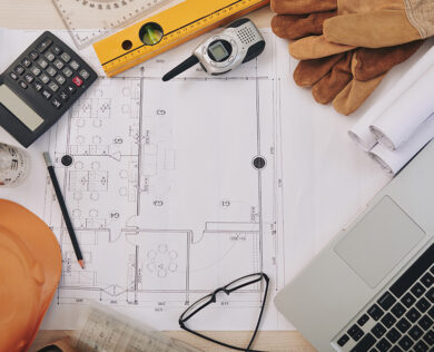 Building plan and contractor belongings around it