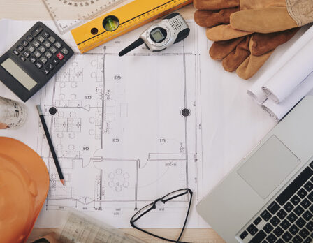 Building plan and contractor belongings around it